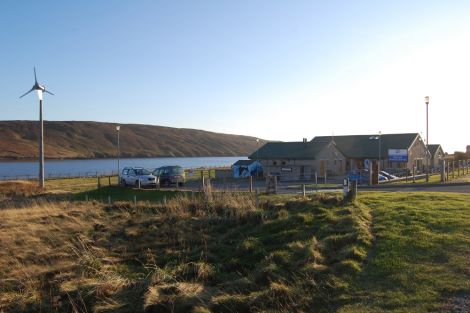 A Proven P11 six kilowatt wind turbine turns at Urafirth primary school, one of two installed for Shetland Islands Council by Shetland Windpower Ltd.