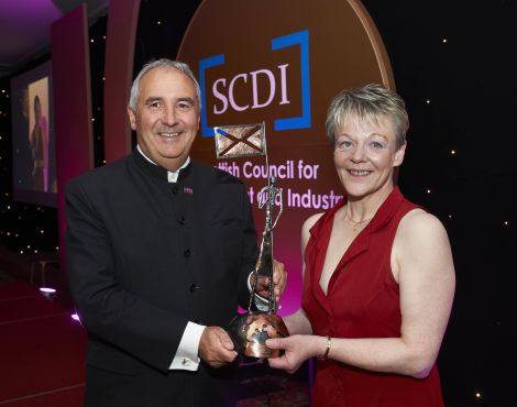 Margaret Blance receives Böd Ayre's award from Creative Scotland chief executive Andrew Dixon.