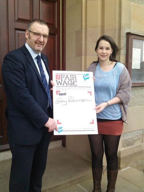 SIC leader Gary Robinson with Shetland MSYP Nicole Mouat after signing the One Fair Wage pledge