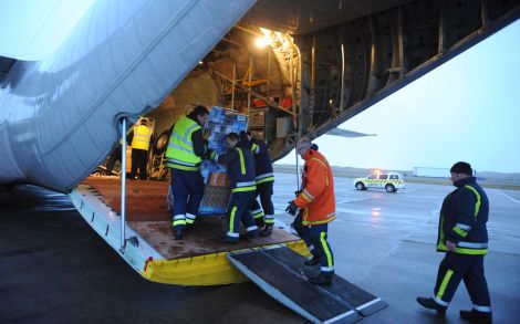Unloading the Hercules cargo plane at Sumburgh airport - Photo: Malcolm Younger/Millgaet Media