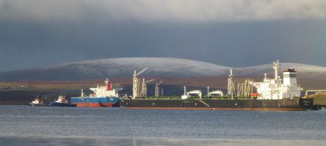 SIC tugs Shalder and Dunter escort the tanker Bravo out of Sullom Voe on New Year's Day while tanker Thornbury continues to load cargo. Pic. John Bateson