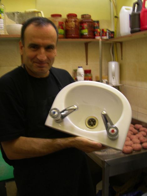 Turkish Delight proprietor Saban Kusmus with his new sink installed after repeated complaints from environmental health officers that he had no hot running water. Pic. SIC
