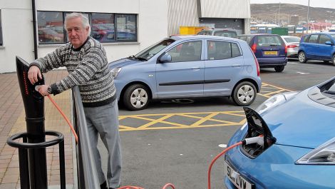 Jim Dickson checking out one of the new charging points in town - Photo: ShetNews