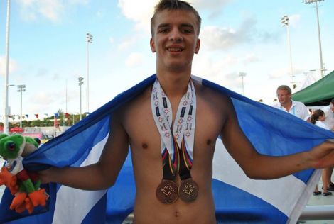 Felix Gifford with the gold and silver medals he won on Tuesday night.