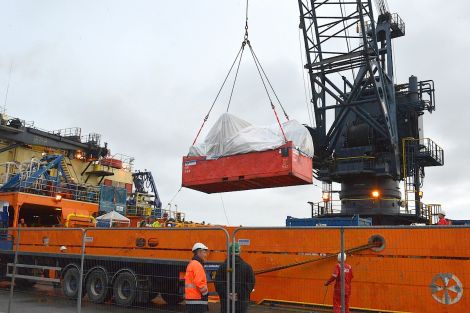 The wreckage of the Super Puma L2 helicopter being unloaded for onward transport at Lerwick harbour on Thursday - Photo: ShetNews