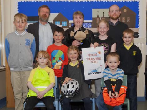 Back, from left to right, are environment and transport committee chairman Michael Stout, road safety officer Elaine Skinley, road safety advisory panel chairman Steven Coutts. Middle row: Scalloway School’s junior road safety officers Leighton Sutherland, Jack Petrie, Alanoss Jamieson and Lewis Mann (all primary six). Front row: runner-up Kirsty Nicolson, winner Maya MacKay and runner-up Haakon van der Tol.