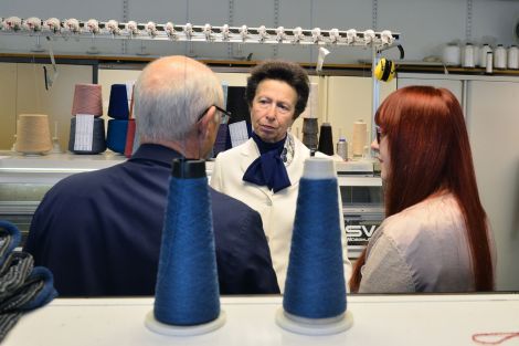 Princess Anne hearing about knitting and textiles from technicians Eric Stewart and Roisin McAtamney. Photo: Malcolm Younger