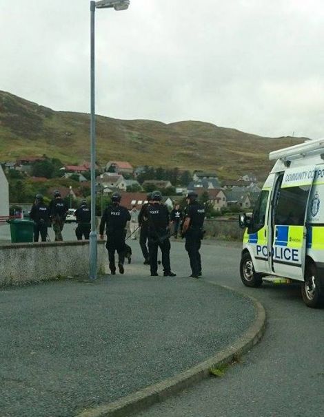 Armed police officers arriving at Westerloch Drive on Tuesday afternoon. Photo: Thomas Ewenson