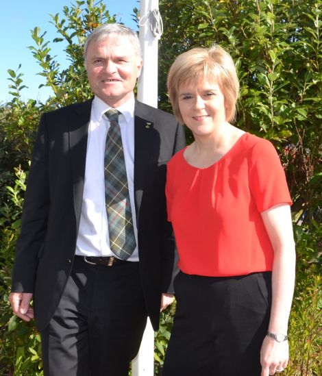 Nicola Sturgeon pictured with Highlands and Islands list MSP Mike Mackenzie during a visit to Shetland in August. Photo: Shetnews