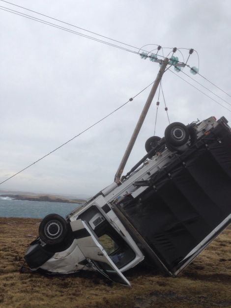 The hydro pole snapped when hit by the van - Photo: Gary Smith/Shetland News