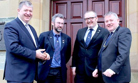 Scottish secretary Alistair Carmichael (left) and the three islands council leaders Steven Heddle (Orkney), Gary Robinson (Shetland) and Angus Campbell (Na h-Eileanan an Iar) agreeing guidelines to ensure that the islands' unique circumstances are being reflected in UK government policies - Photo: Pete Bevington/ShetNews