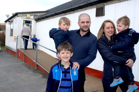 New shop owners Ryan and Lesley Thomson with their three boys Lewis (1), James (7) and Gary (2) - Photo: Hans J Marter/ShetNews
