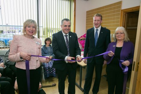 At the ribbon cutting of the new office are (left to right) Ann Williamson, Dementia Advisor, Henry Simmons - Chief Executive of Alzheimer Scotland, Tavish Scott - MSP and Heather Fisher - Chair of the Shetland Branch. - Photo: John Coutts