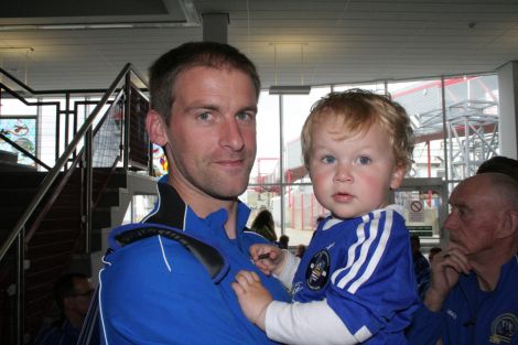 Shetland's football captain Leighton Flaws with his son Spencer. Photo: Shetnews/Chris Cope