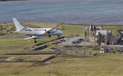 John Moncrieff's stunning image used by the Facebook campaign of a Loganair/Flybe Saab 340 above Sumburgh Hotel, where campaigners met Loganair bosses on Thursday evening.