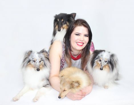 Lerwick woman Kaylee Robertson with her four sheepdogs.