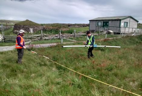 Adam Booth and Jonathan Marsh carrying out electromagnetic surveys at Scatness.