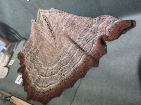  No 2, a lace triangular shawl. Handspun, dyed with madder and tea, plus natural colours of grey, fawn, charcoal, moorit and mooskit. Photo: Helen Robertson