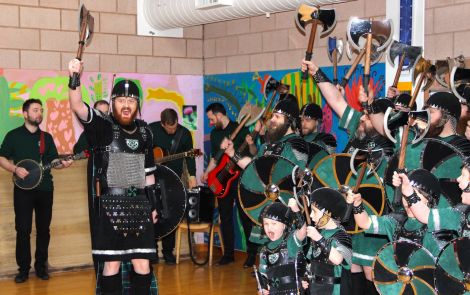 Delting guizer jarl John Duncan and his squad performing the Up Helly Aa song at Lunnasting Primary School - Photos: Hans J Marter/Shetland News
