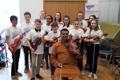 Tutor Balu Raguraman with his class of fiddle students from London and Shetland.