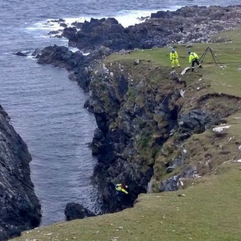 The dog was rescued after losing its footing near Haroldswick. Photo: Dave Sweeney/MCA.