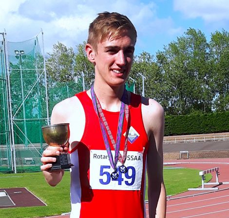 Gold medal winner Seumas Mackay was also awarded a a Cup for the best 800m performance at this year’s championships. Photo: Shetland Athletics.