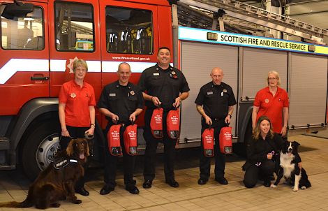 Accepting the final set of resuscitation masks from Pheona Horne (left) and Tricia Brown (right) are (from left to right) SFRS local group manager Myles Murray, SFRS local senior officer Western Isles, Orkney and Shetland Fraser Burr, watch manager Andrew Hunter and Sophi Chapman.