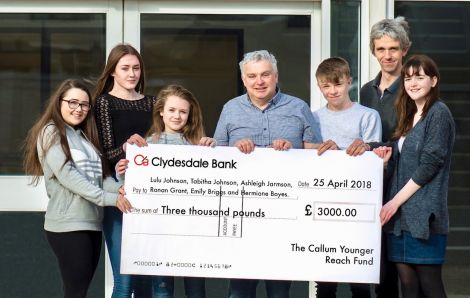Chairman of the Callum Younger Reach Fund, Malcolm Younger, hands out funds to (left to right): Lulu Johnson, Tabitha Johnson, Ashleigh Jarmson, Ronan Grant, Emily Briggs’ dad Kevin and Hermione Boyes. Photo: Andrew Gibson