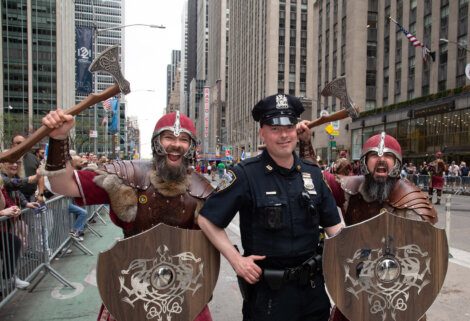 A police officer wearing a viking costume.