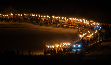 A group of people with torches.