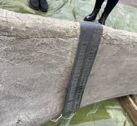 A piece of concrete with a label on it.
