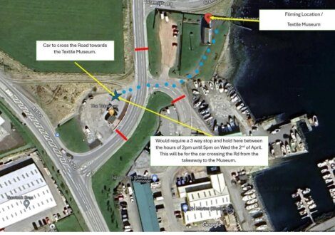 Aerial map view outlining a proposed traffic plan with annotations for a filming location near a textile museum, including a car path and a required stop-and-hold area.